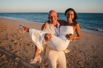 Luxury wedding photography and videography in Algarve & Europe. Vidamar Resort Albufeira wedding venue. Elegant, emotional photography storytelling by Olga & Igor Rosi, Algarve Pictures. Full-day, elopement & destination packages available. Bride and groom portrait at sunset by the ocean in Albufeira.